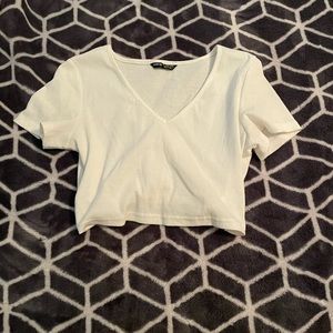 White v-neck crop top with tie back.